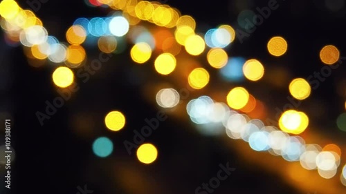 Night city street traffic bokeh lights. Slow motion
