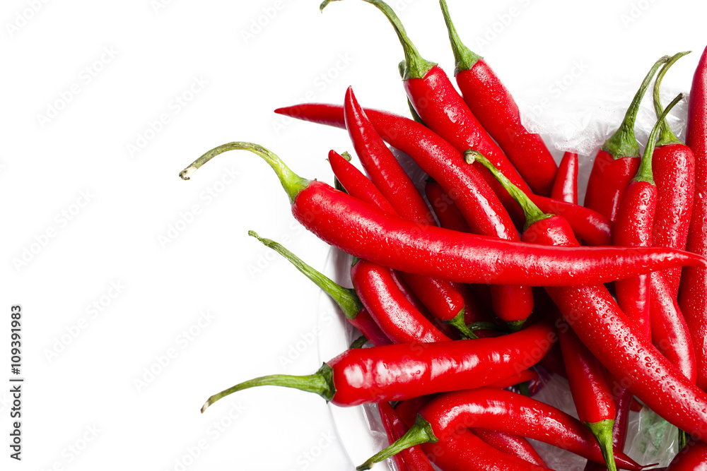 wet chilli peppers in a bowl wet chilli peppers in a bowl