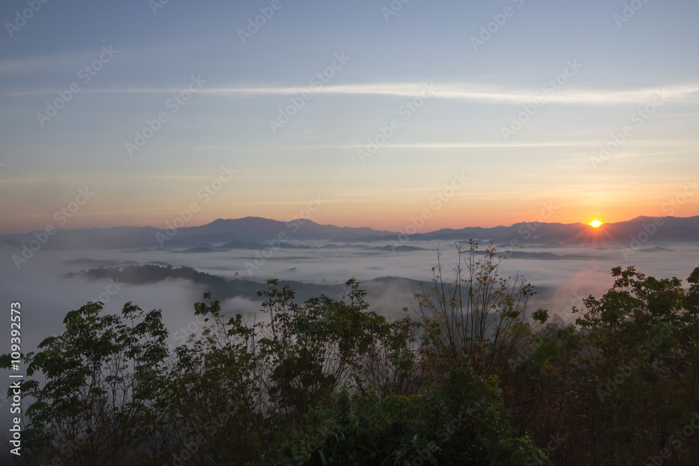 The sun rises in the mist at Khao Kai Nui, Phangnga Thailand