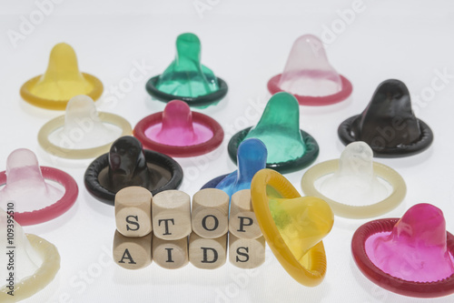 colorful condoms with words stop aids photo