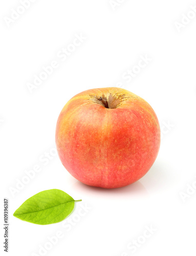Ripe apple with leaf.