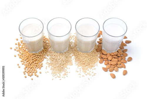 Vegetable milk: soy milk, rice milk, oat milk and almond milk isolated on white background. photo