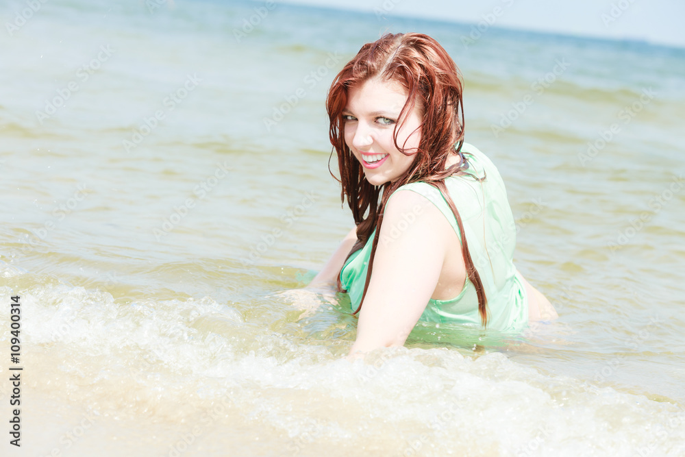 Sensual girl wet cloth in water on the coast. Sensual girl wet cloth in water on the coast.