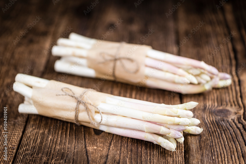 White Asparagus (selective focus) on wooden background White Asparagus (selective focus) on wooden background