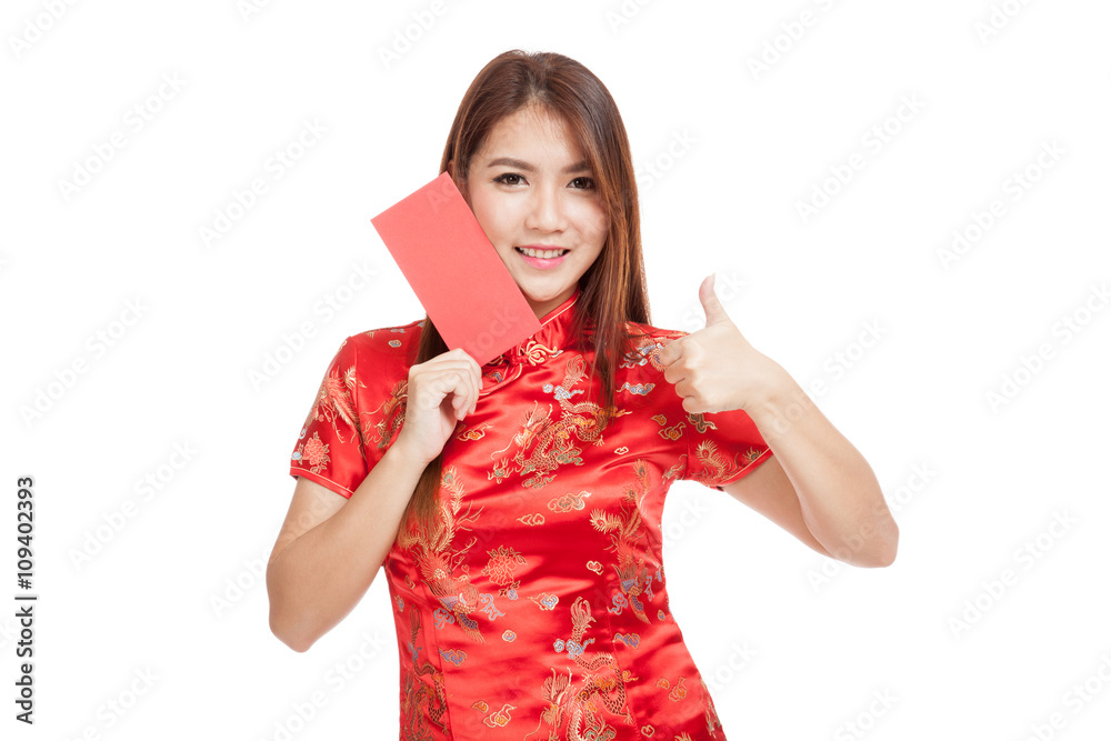 Asian girl in chinese cheongsam dress thumbs up with red envelop Asian girl in chinese cheongsam dress thumbs up with red envelop