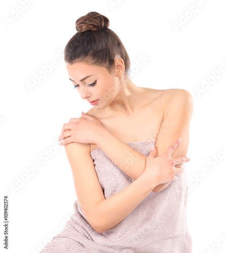 Beautiful young girl wrapped in a towel  isolated on white