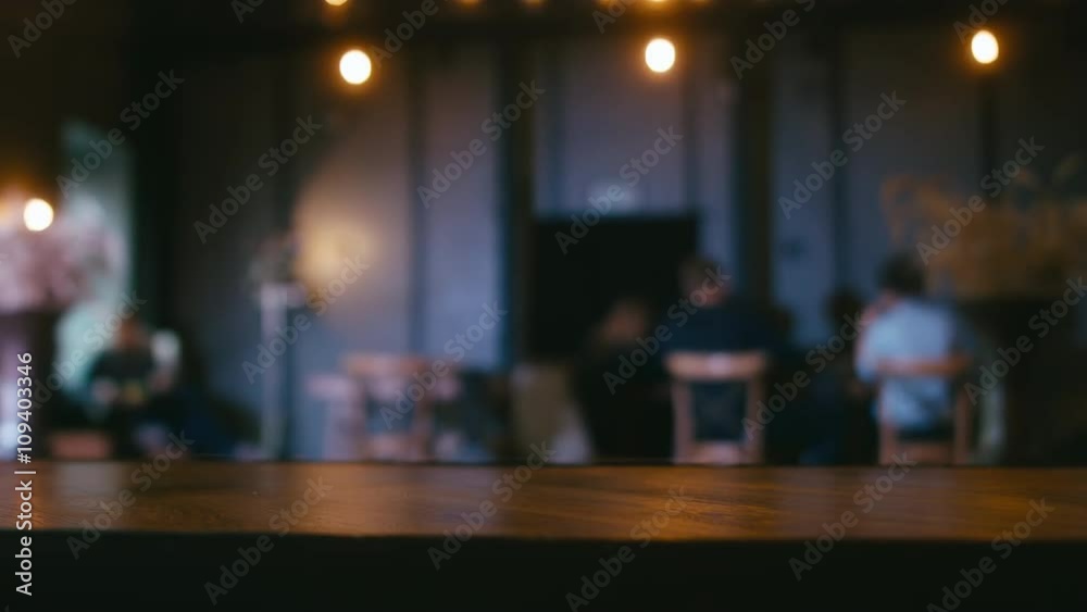 Defocused background - a group of people is sitting in a modern restaurant. Shot with Blackmagic URSA Mini