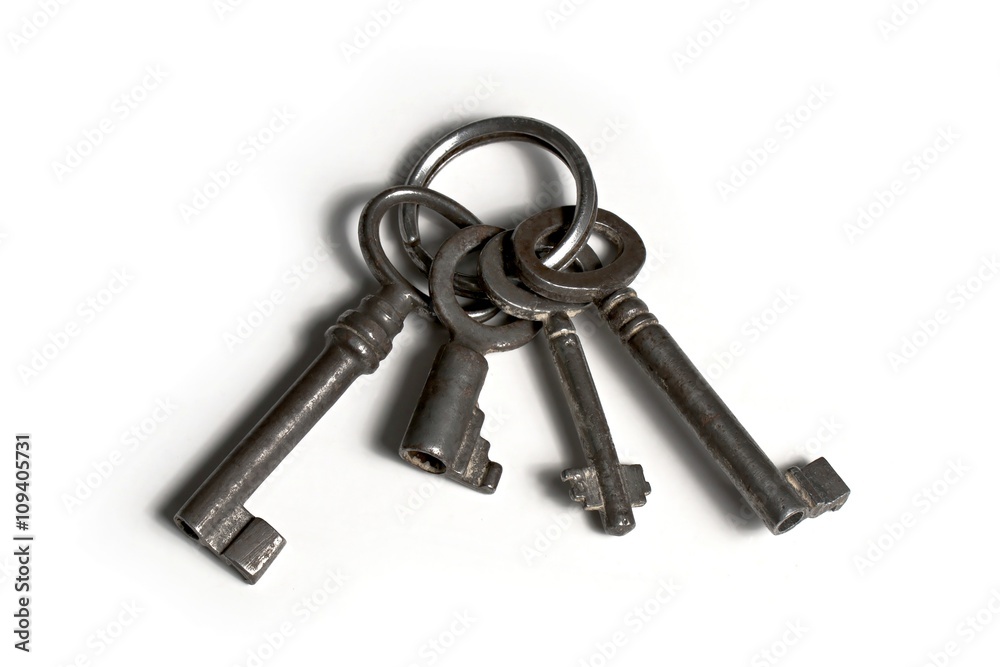 four old keys on keyringwith rust and dirt four old keys on keyringwith rust and dirt