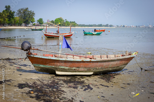 Fishing Boat on dirty Beach