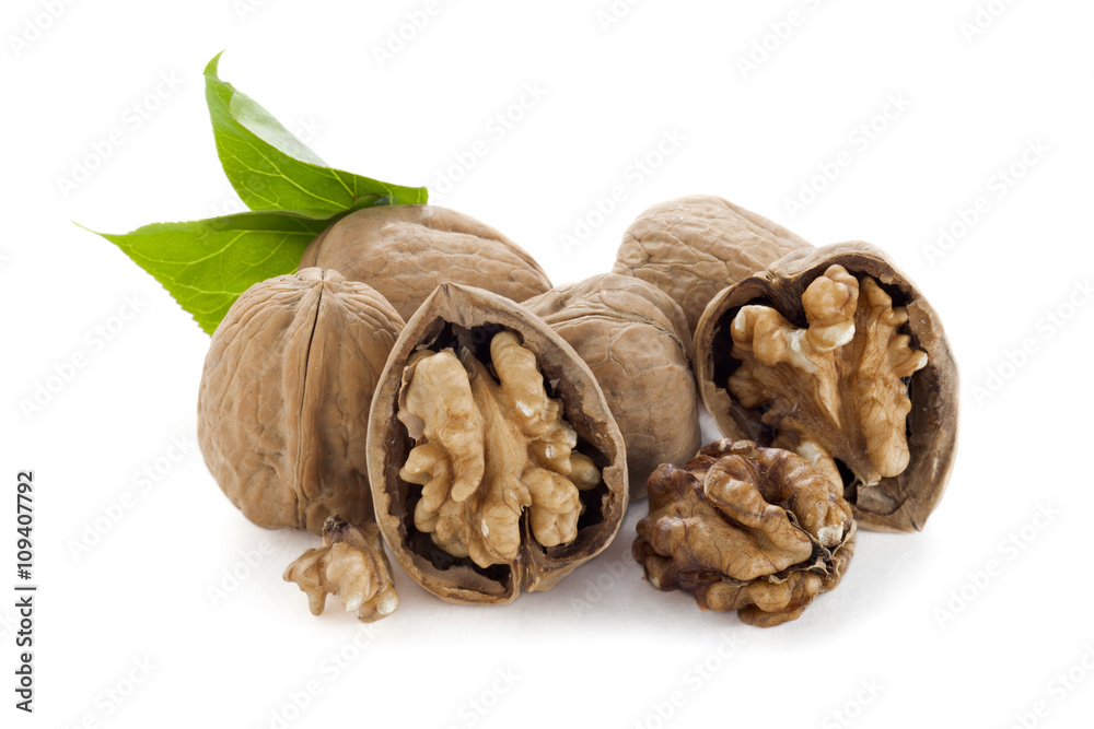 pile of walnuts with leaves pile of walnuts with leaves