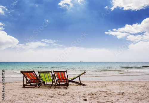 Beach chairs on beautiful tropical beach