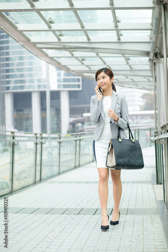 Free Download Business woman walking outside in Hong Kong - GFXLoad