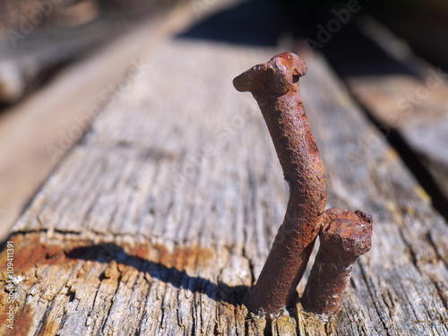 Two rusty curved nails macro