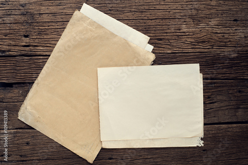 Empty old paper on wooden table - vintage background