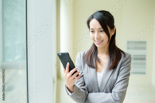 Woman use of mobile phone at office