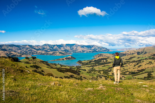 Men watching the Bay of Akaroa, New Zealand 