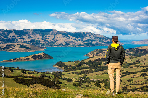 Men watching the Bay of Akaroa, New Zealand 