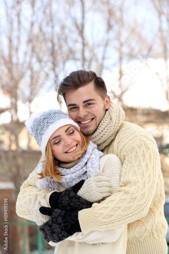 Young couple embracing outd...