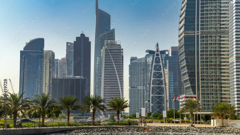 Residential buildings in Jumeirah Lake Towers timelapse in Dubai, UAE. Residential buildings in Jumeirah Lake Towers timelapse in Dubai, UAE.