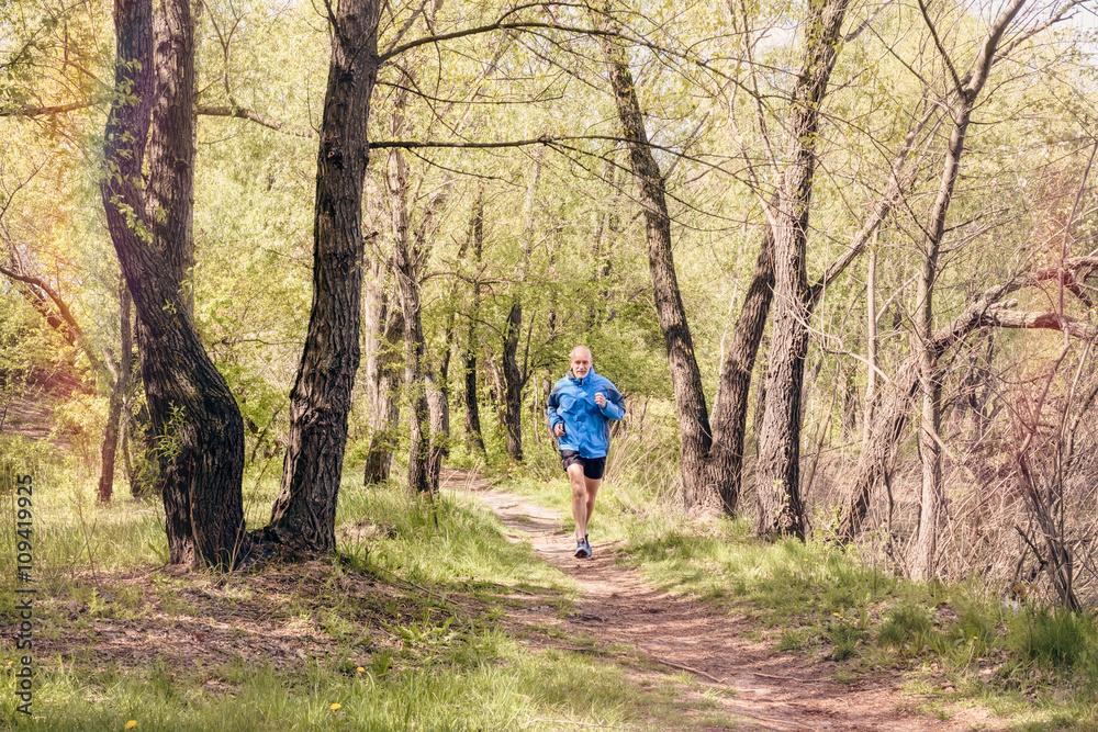 Senior Man Running in the Forest Senior Man Running in the Forest