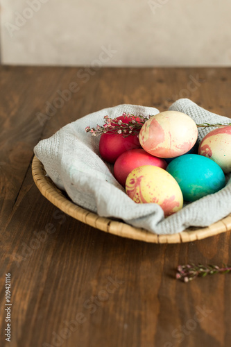 Colored Easter eggs in basket