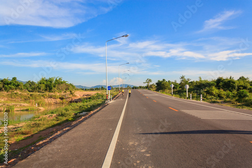 cycling on the road in country side photo