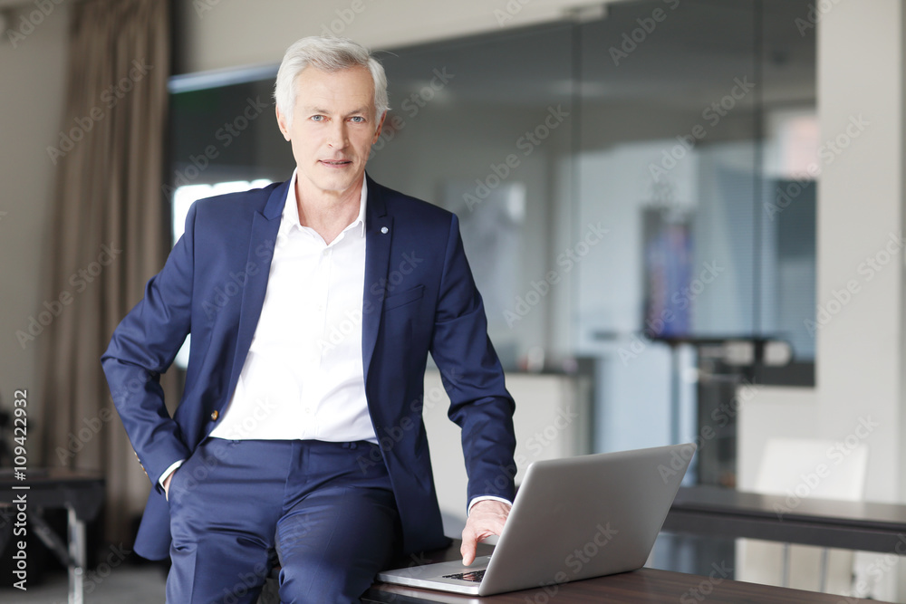 Businessman working on laptop at office Businessman working on laptop at office