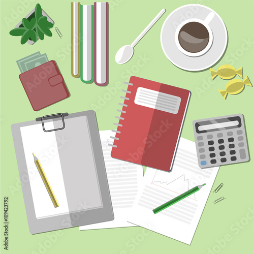 Modern home office with coffee, clipboard and documents.