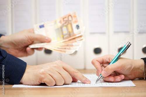 employer or businessman showing where to sign  in exchange to gi