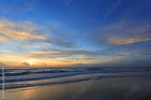 sunrise sky in the morning with colorful cloud on the beach © sutichak