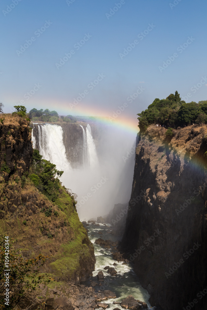 Victoria Falls in October with rainbow crossing Victoria Falls in October with rainbow crossing