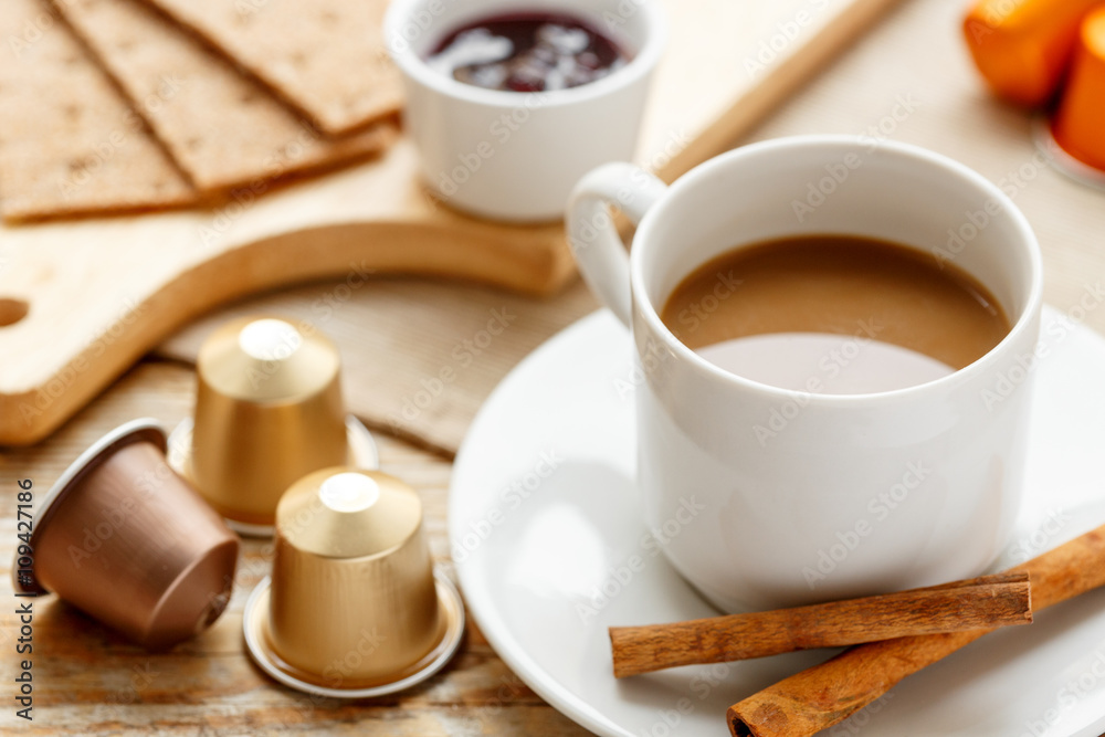 Breakfast with coffee and croissants on wooden table Breakfast with coffee and croissants on wooden table