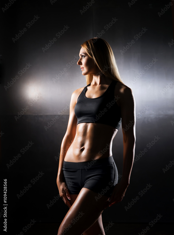Fit and sporty woman posing in sportswear Fit and sporty woman posing in sportswear