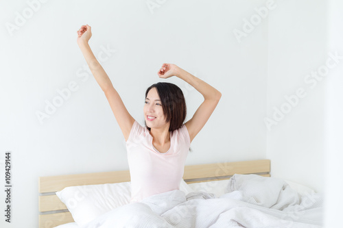 Joy cheerful happy woman waking up with a smile