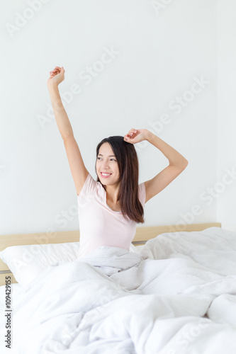 Woman relaxing in her bed