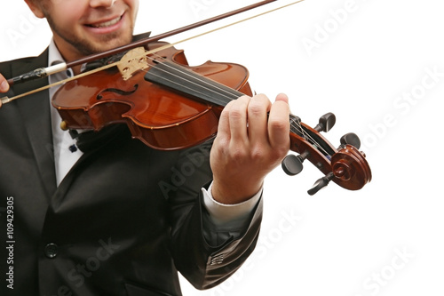 Musician plays violin isolated on white background, close up