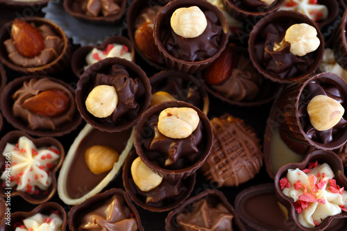 Delicious chocolate candies background, close up © Africa Studio