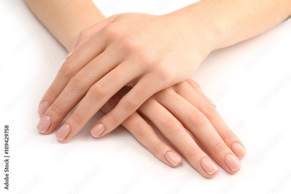 Woman hands with beautiful manicure isolated on white background