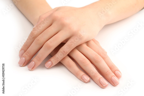 Woman hands with beautiful manicure isolated on white background