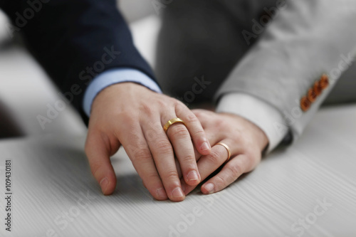 Two  homosexuals wearing wedding rings photo