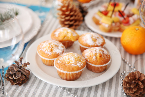 Tasty muffins in a Christmas dinner table