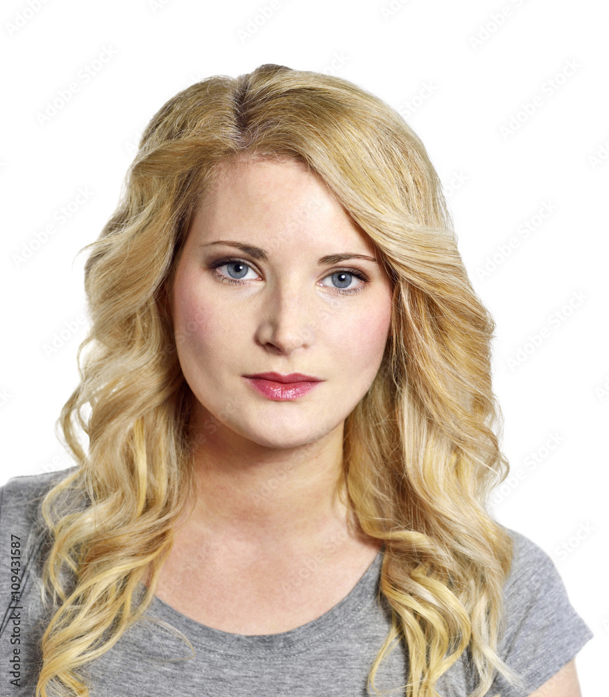 Beautiful blond woman looking to the camera. Positive Emotions. Young woman with copy space, isolated on white background.
