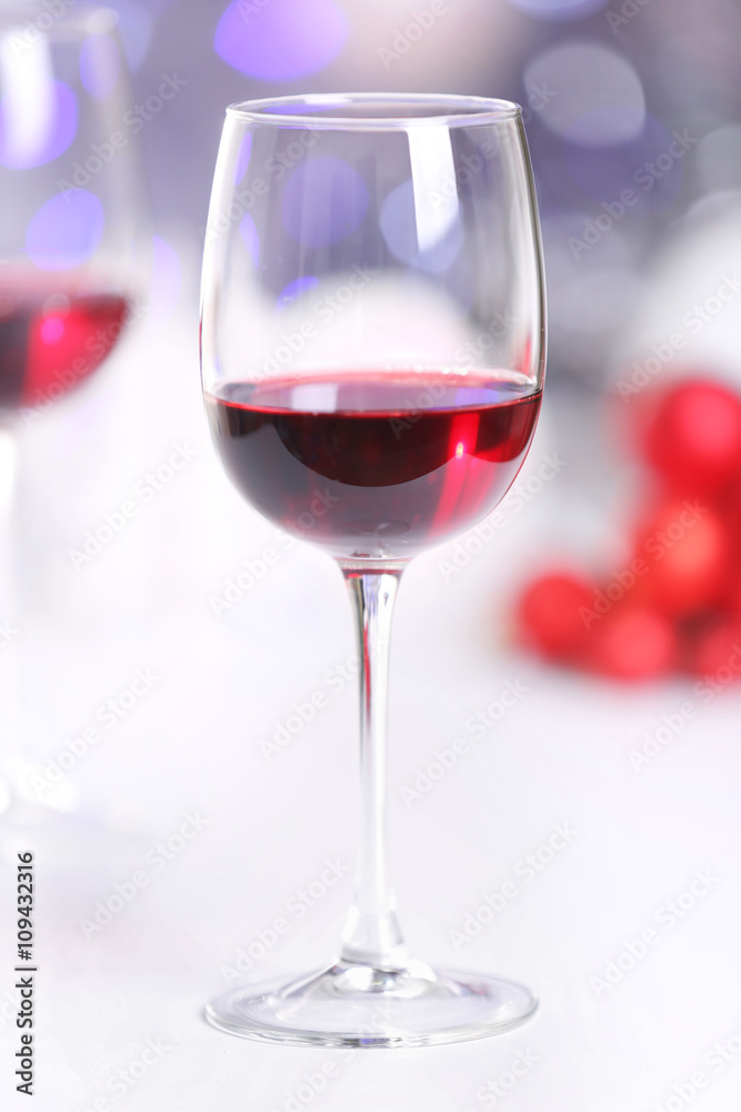 Wineglasses on blurred lights background