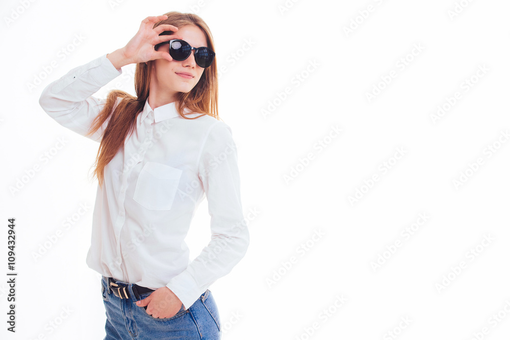 Cute blonde keeps the sunglasses in the Studio on a white backgr Cute blonde keeps the sunglasses in the Studio on a white backgr