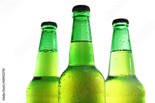 Bottles with fresh beer isolated on white