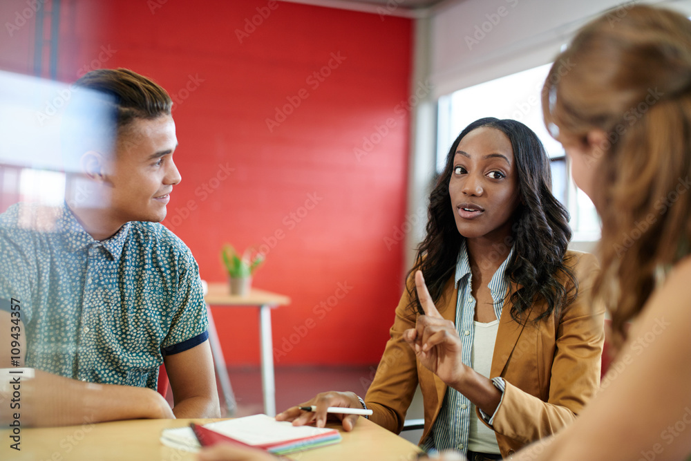 unposed-group-of-creative-business-people-in-an-open-concept-office