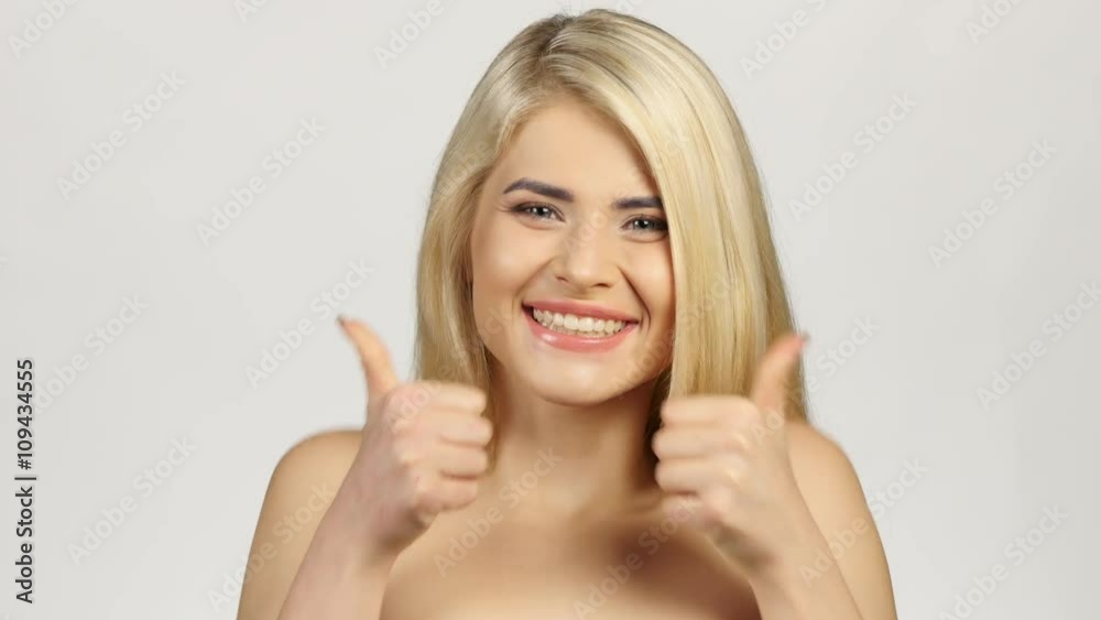 Blonde woman smiling facing forwards. White Blonde woman smiling facing forwards. White
