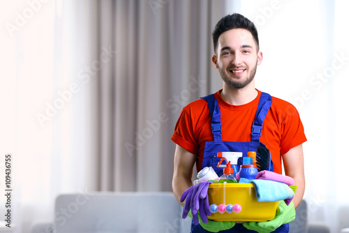 Man holding plastic basin w...