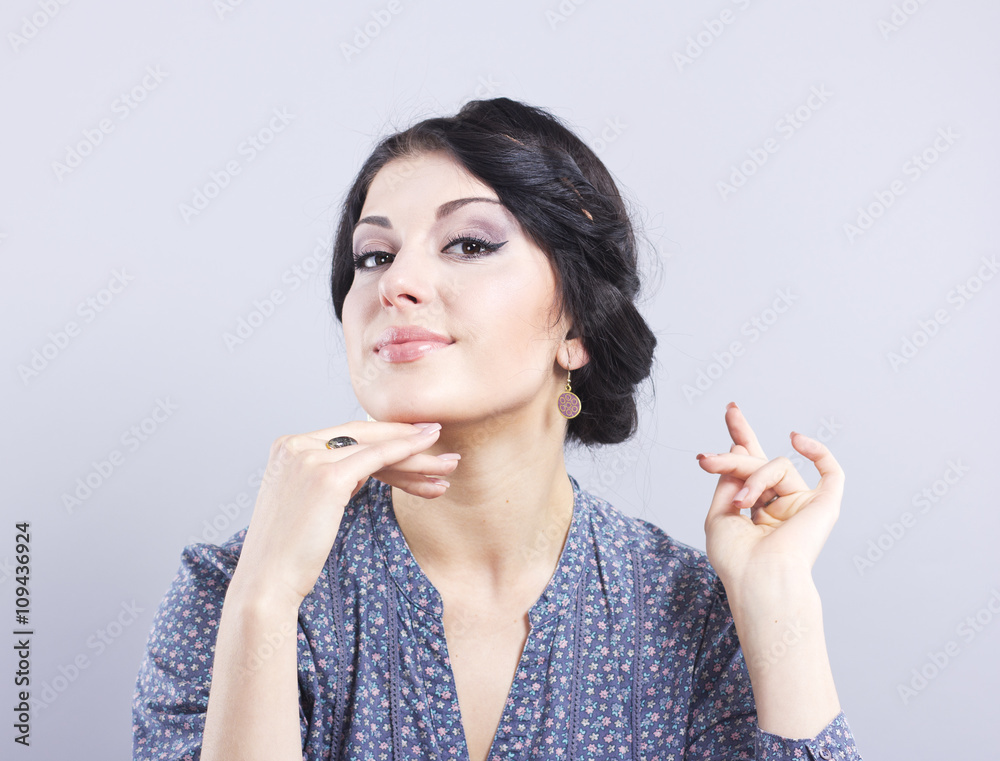 Beautiful brunette on a gray background.Eyelash extensions. Lip augmentation. nail extension
Beautiful brunette on a gray background.Eyelash extensions. Lip augmentation. nail extension
