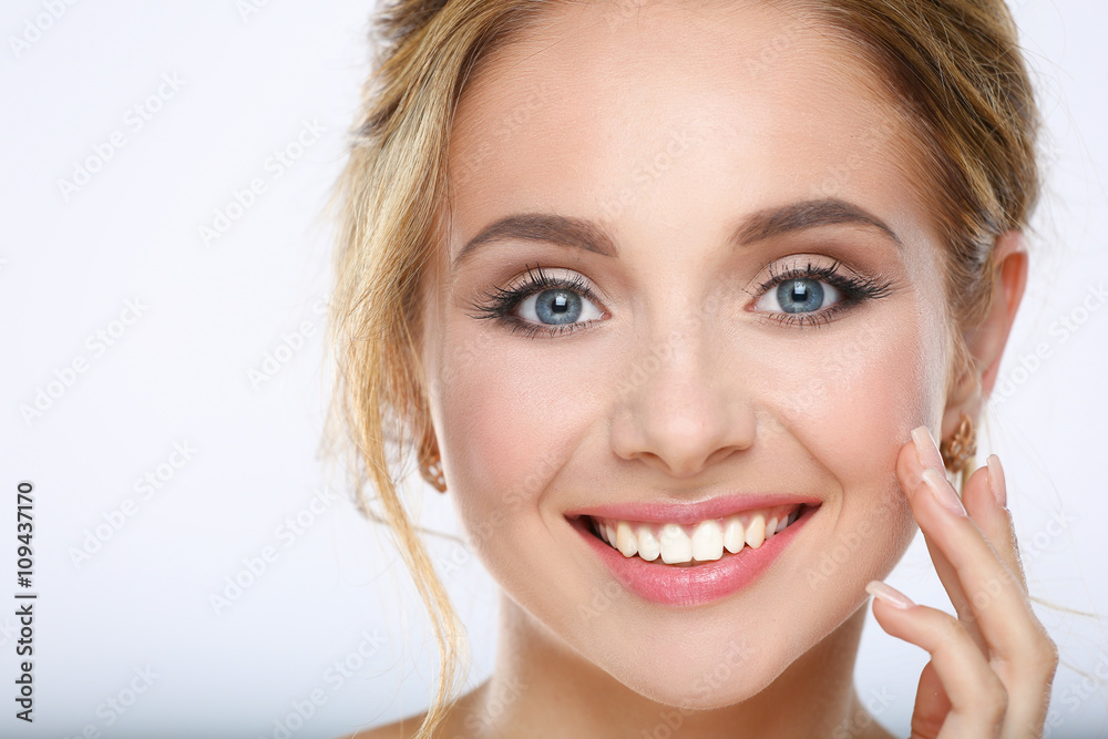 Fototapeta premium Portrait of beautiful woman on white background